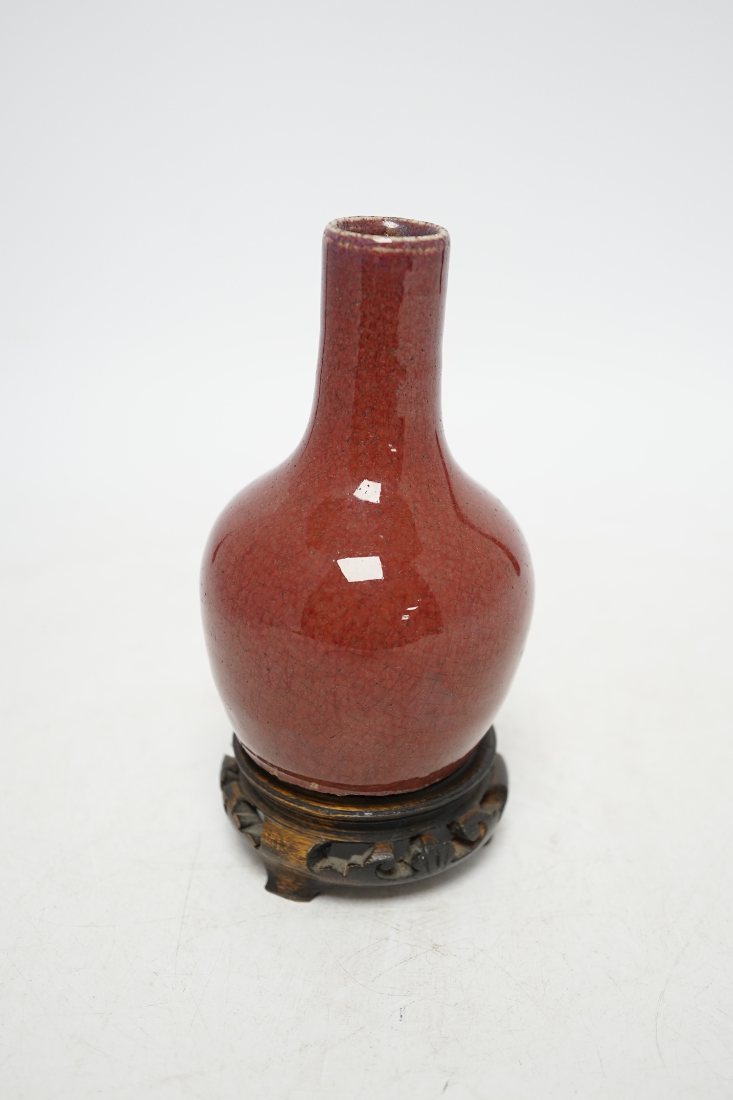 An 18th century Chinese sang de boeuf vase and associated stand, overall 16cm high. Condition - good